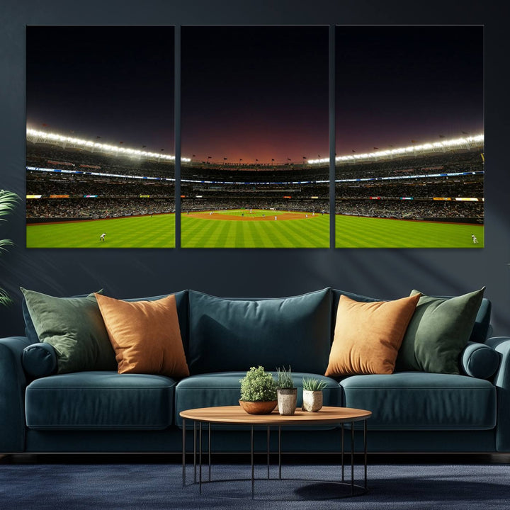 A night game at Yankee Stadium depicted on canvas beneath a sunset sky.