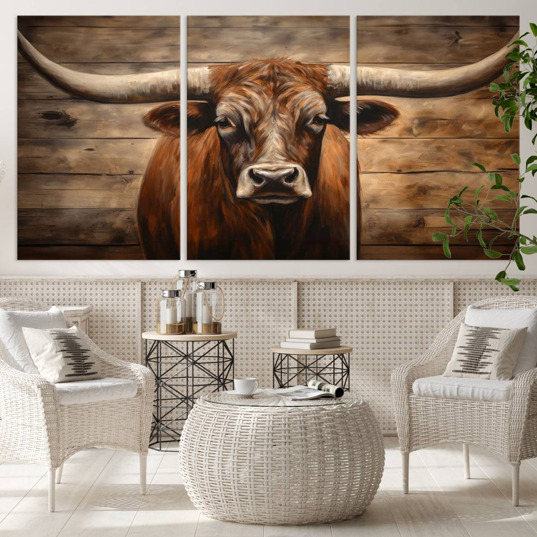 The Longhorn Bull Wall Art, a ready-to-hang canvas print, showcases an image of a brown longhorn cow set against a wooden background, perfect for those looking to enhance their space with rustic farmhouse and western barn decor.