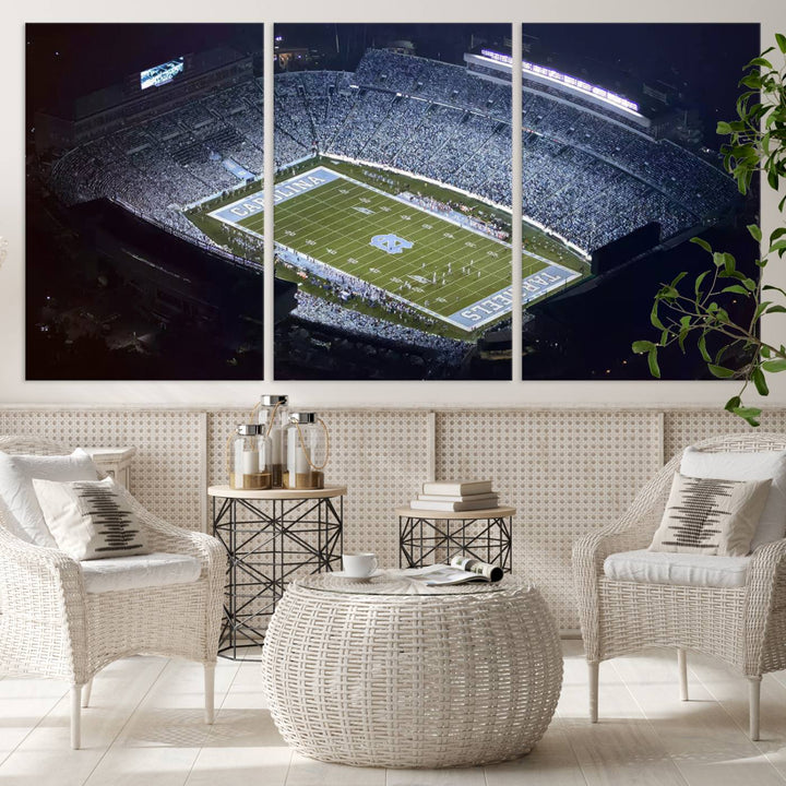 A University of North Carolina Tar Heels Football Team Print, showcasing Chapel Hill's Kenan Memorial Stadium, hangs in a modern dining room, adding a gallery-quality finish that enhances the entire space.