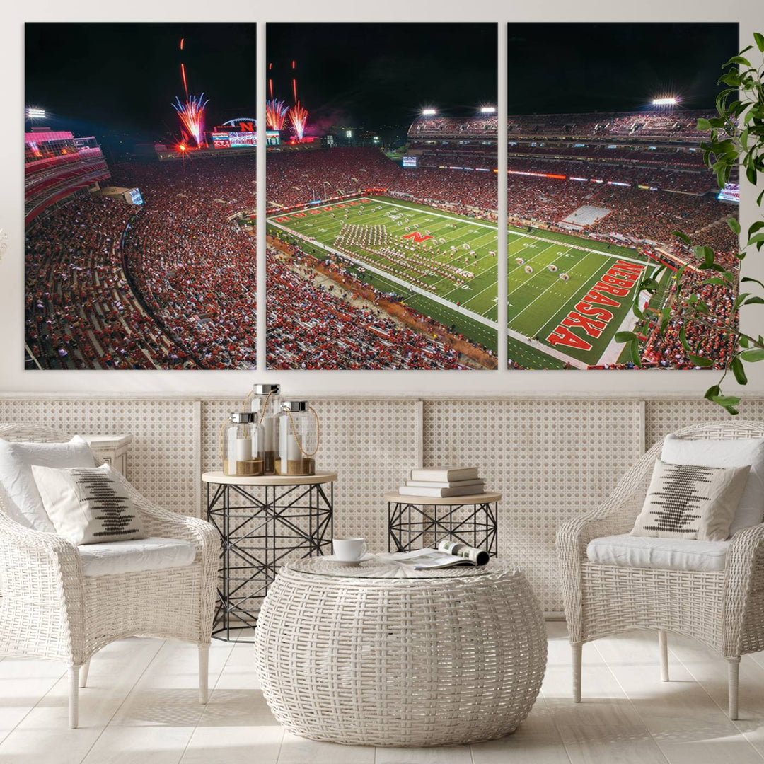 The University of Nebraska Cornhuskers Football Team Print, featuring Lincoln Memorial Stadium in a vibrant triptych canvas with fireworks above and a gallery-quality finish, is elegantly displayed.