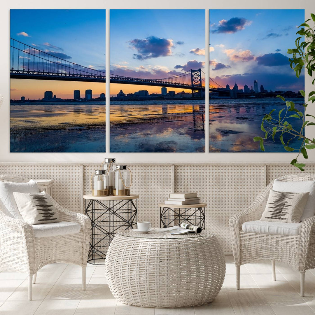 A photograph titled "Large Wall Art Philadelphia Canvas Print - Benjamin Franklin Bridge at Sunset" displays a breathtaking cityscape of the bridge reflected in the water. This image features a gallery-quality finish that promises to transform any space into an evocative memory.