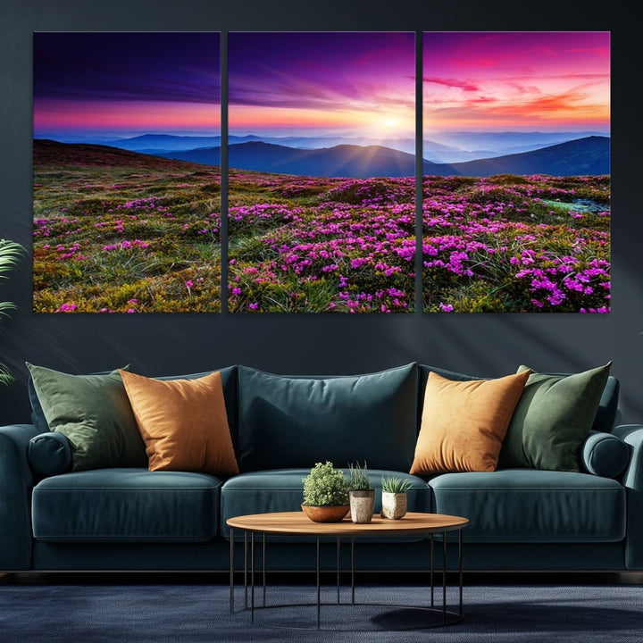 A 3-panel landscape photography canvas of a sunset over mountain meadows with purple wildflowers decorates the wall.