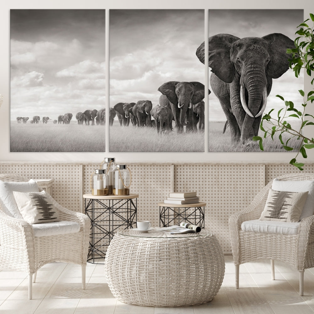 The "Herd of Elephants Wall Art Canvas Print" features an elegant black and white triptych of elephants walking in a line, beautifully displayed on museum-quality canvas with a UV-protective coating. This artwork arrives ready to hang and adds sophistication to any space.