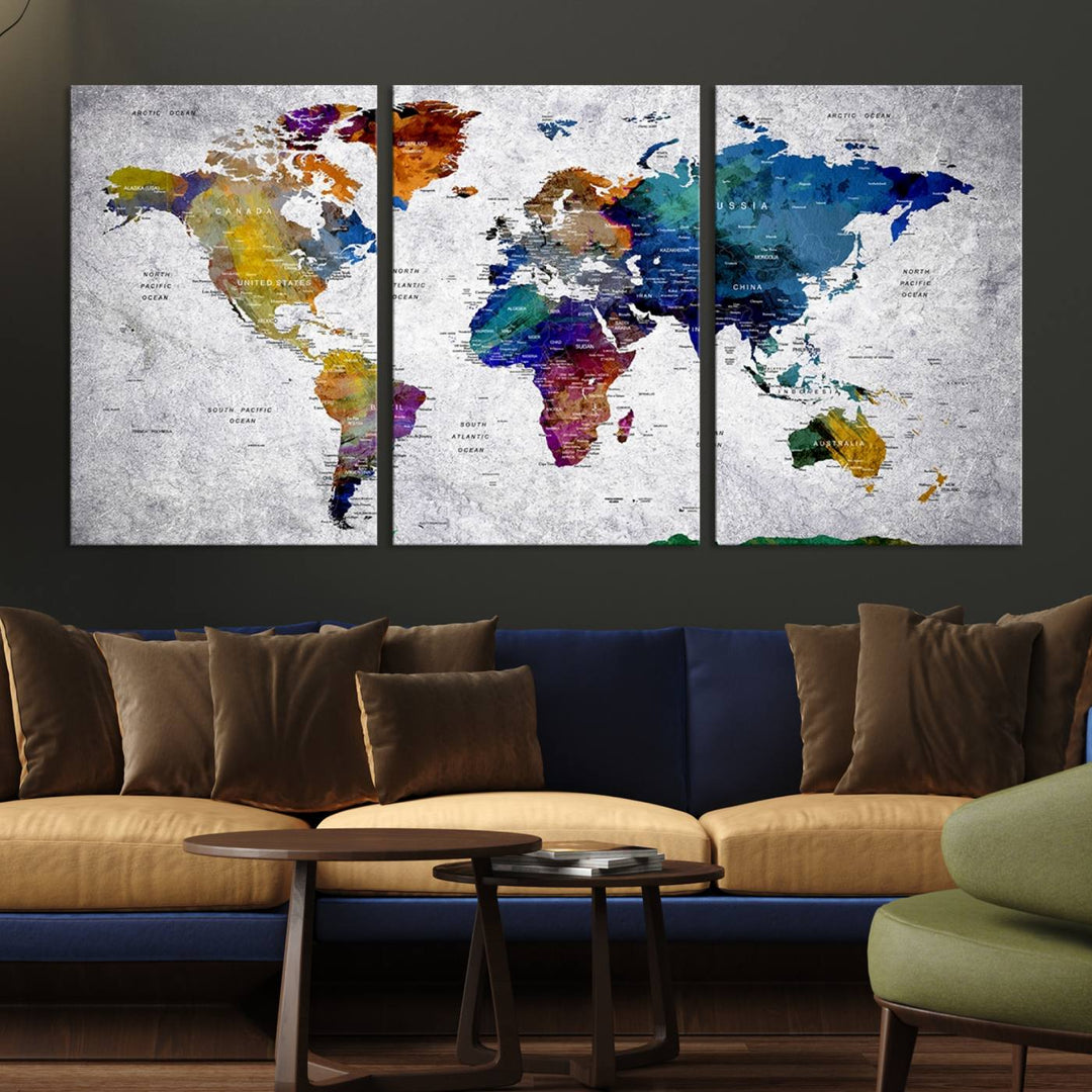 The World Map Art Canvas Print, featuring country names on a grunge-stained gray background, is perfect for stylish home decor.