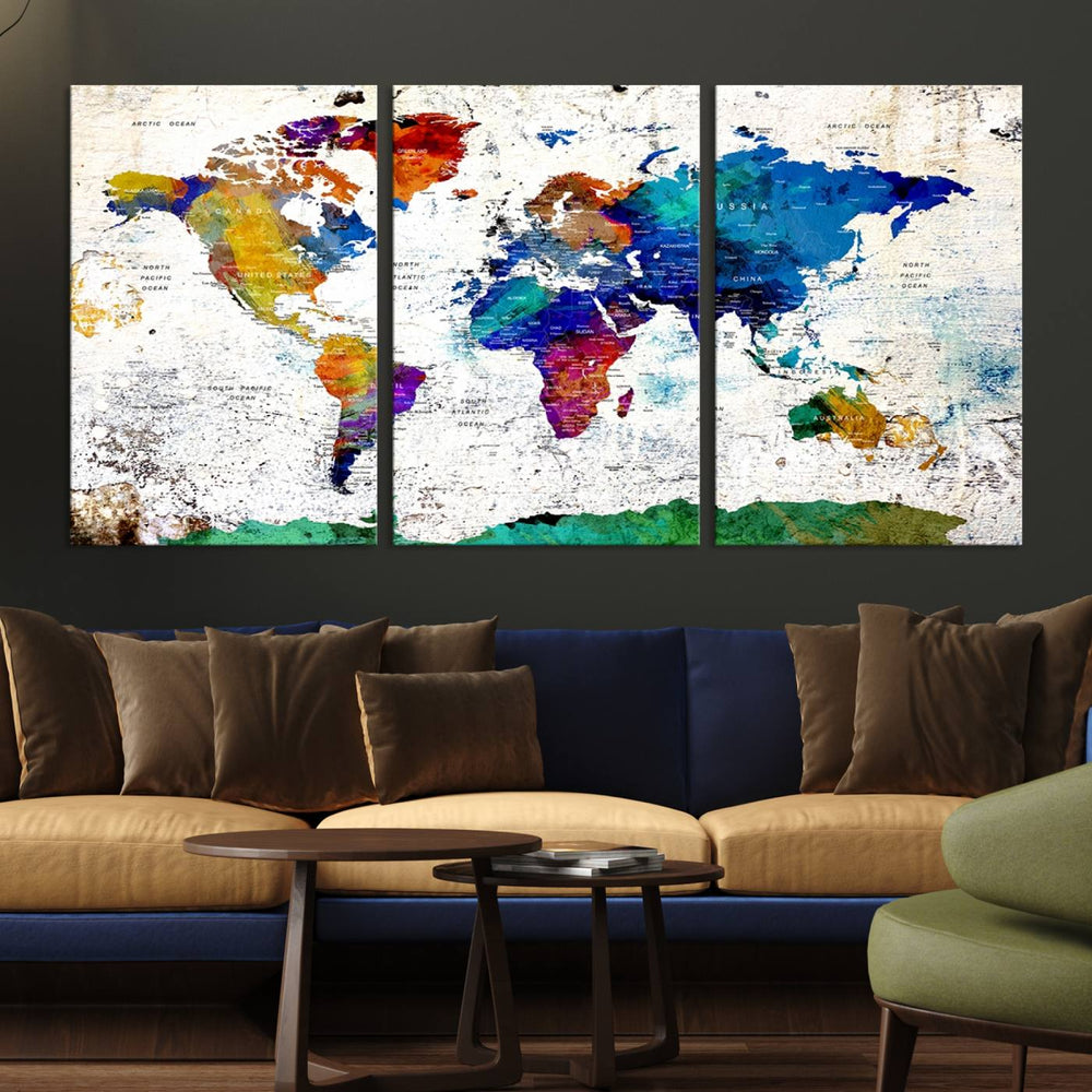 The wall art features the Colorful Abstract World Map – a vibrant contemporary triptych map print.