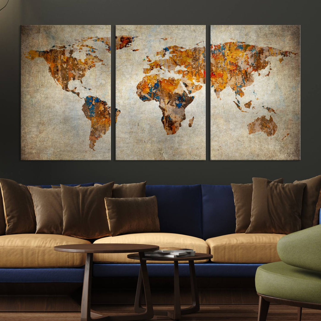 Vintage World Map Canvas Print showcasing an artistic, abstract design in earthy orange, blue, and brown on a grunge-stained background.