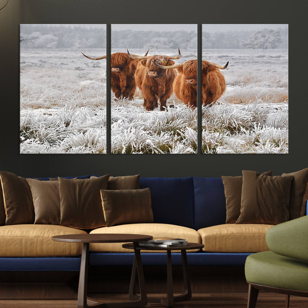 The Highland Cows in Snow canvas showcases three cattle in a frosty field.