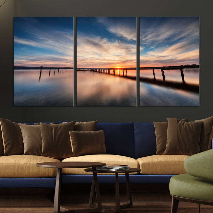 The Sunset Pier Canvas features a serene coastal landscape with vibrant hues under cloudy skies, ideal for modern decor.