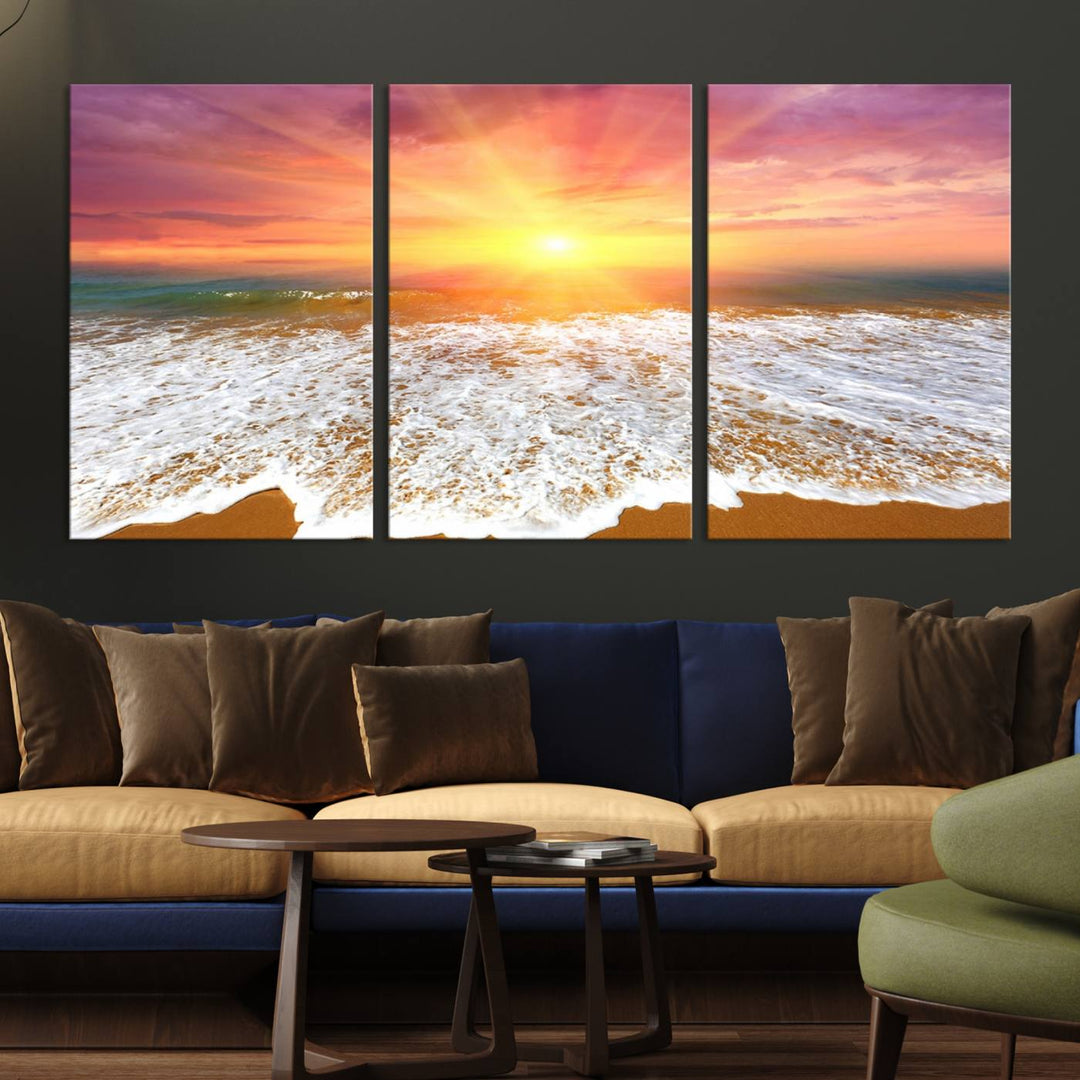 Golden Beach Sunrise 3-panel canvas art of ocean waves, hung on a wooden wall.