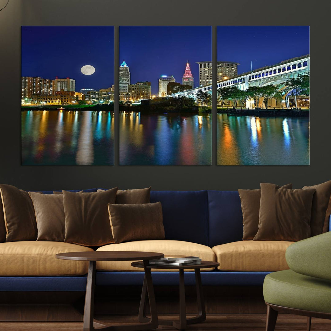 Cleveland City Lights Night Skyline Wall Art canvas showcases a moonlit cityscape reflected on water.