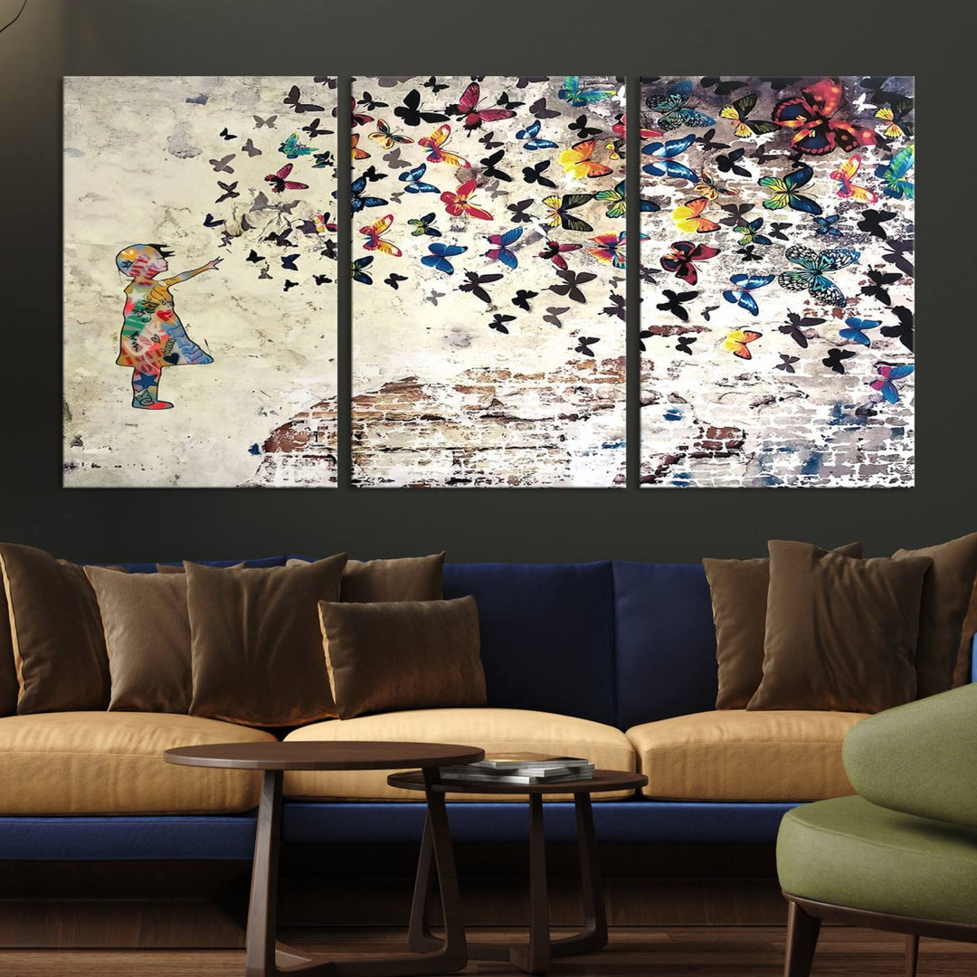 A Banksy Girl Butterfly Canvas Print is displayed on the textured wall.