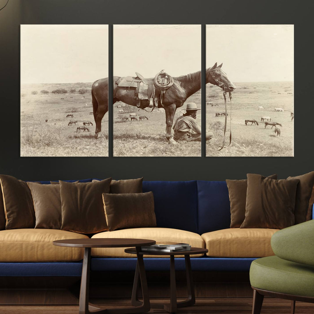 Cowboy Wall Art - Vintage Western Horse Canvas Print features a cowboy kneeling by his horse in a field.