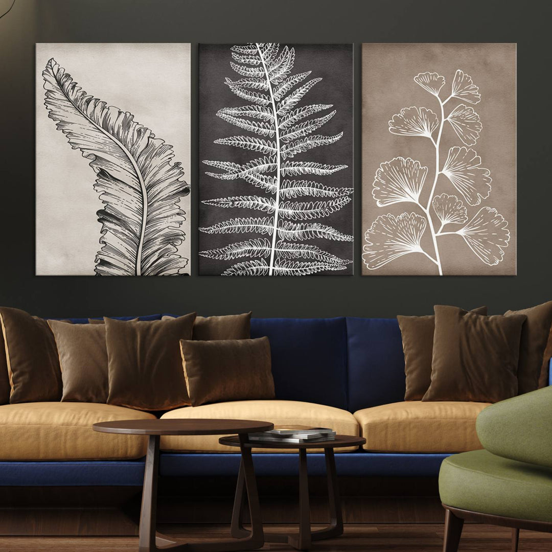 Three framed botanical wall art pieces are displayed in a bright room.