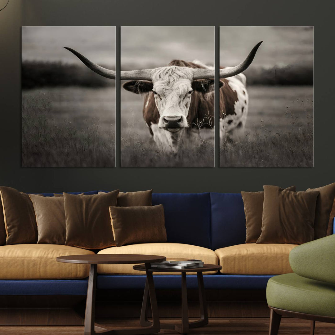 The Texas Longhorn Cow Canvas Wall Art Print adds a rustic touch to a living room.