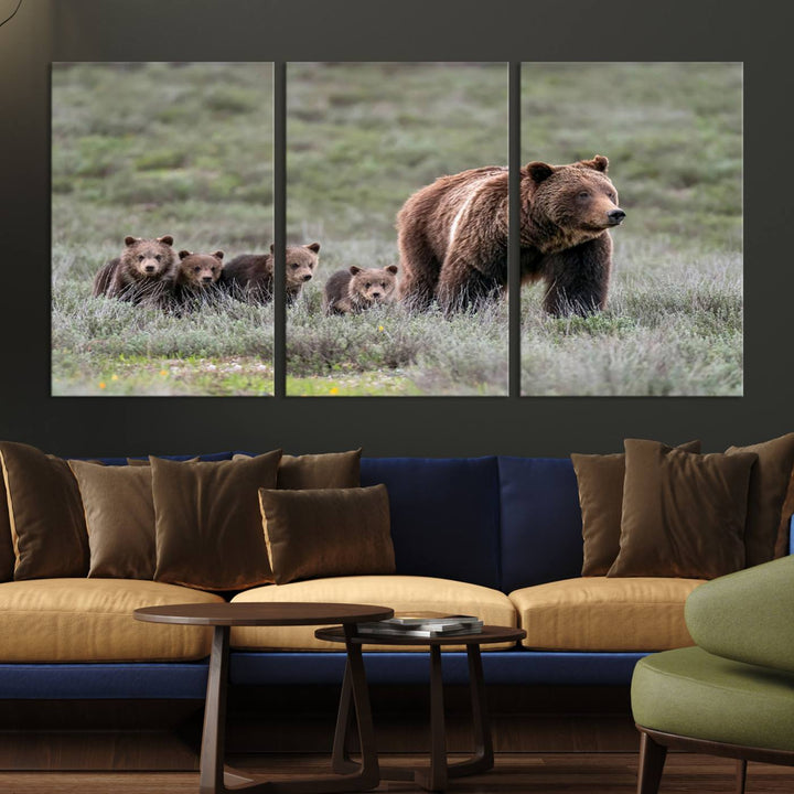 The large canvas print titled "Queen of the Tetons, 399 Grizzly Bear Cubs" showcases majestic wildlife photography of a bear and her cubs walking through the grass. This stunning canvas wall art, handmade in the USA, adds a charming touch to any room with its rustic decor appeal.