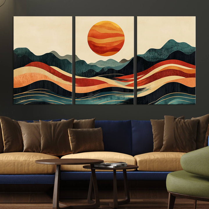 The Mountain Triptych wall art, featuring a design of the sun, mountains, and waves, is displayed prominently on the wall.