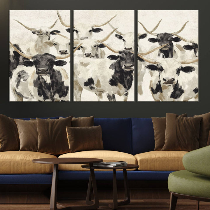 Canvas print titled Longhorn Texas Cow Drawing, depicting longhorn cattle with black and white markings, made in the USA, displayed on the wall.