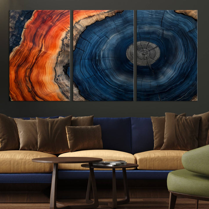 Abstract Tree Ring Wall Art Print on canvas featuring vibrant blue, orange, and brown rings with a natural rustic wood texture. Free shipping available!.