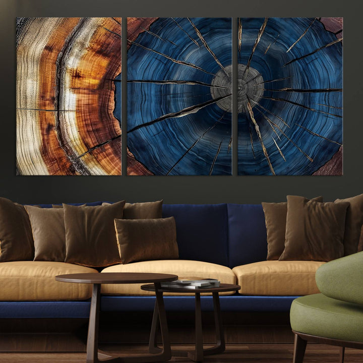 The Abstract Tree Rings Canvas Print features blue, brown, and orange rings that highlight wood grain and natures beauty.