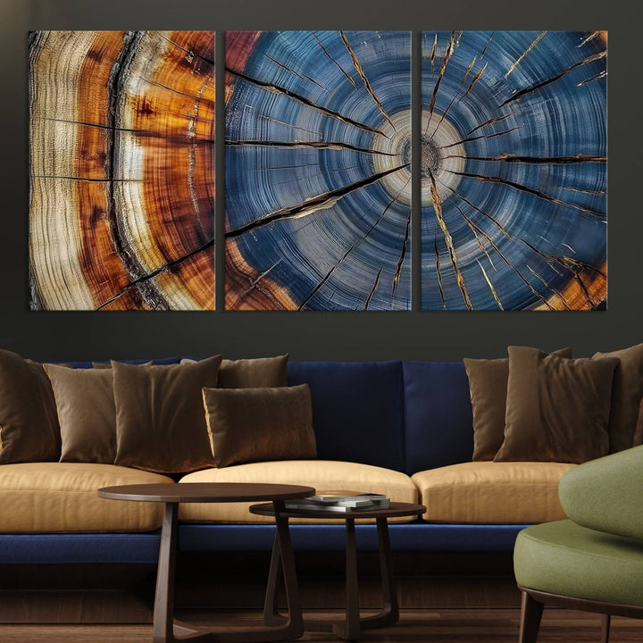 Close-up of blue, brown, and orange wood grain rings on the Abstract Tree Rings Canvas Wall Art Print.