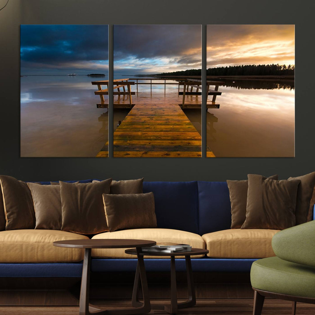 The "Serene Lake Pier at Sunset" landscape canvas print, crafted as ready-to-hang and framed wall art, enriches the contemporary setting by capturing the tranquility of a lakeside pier at sunset.