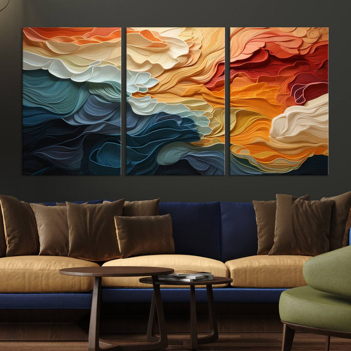 A Blue Orange Abstract Wave Wall Art Canvas Print adorns the wall. This colorful masterpiece is professionally hand-assembled to enhance any space.