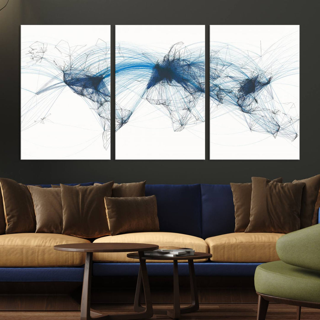 The Aviation Flight Map Wall Art is a set of three abstract panels featuring a world map with blue lines, resembling a flight map. Ideal for aviation enthusiasts, this ready-to-hang framed air traffic art print enhances the appeal of modern decor.