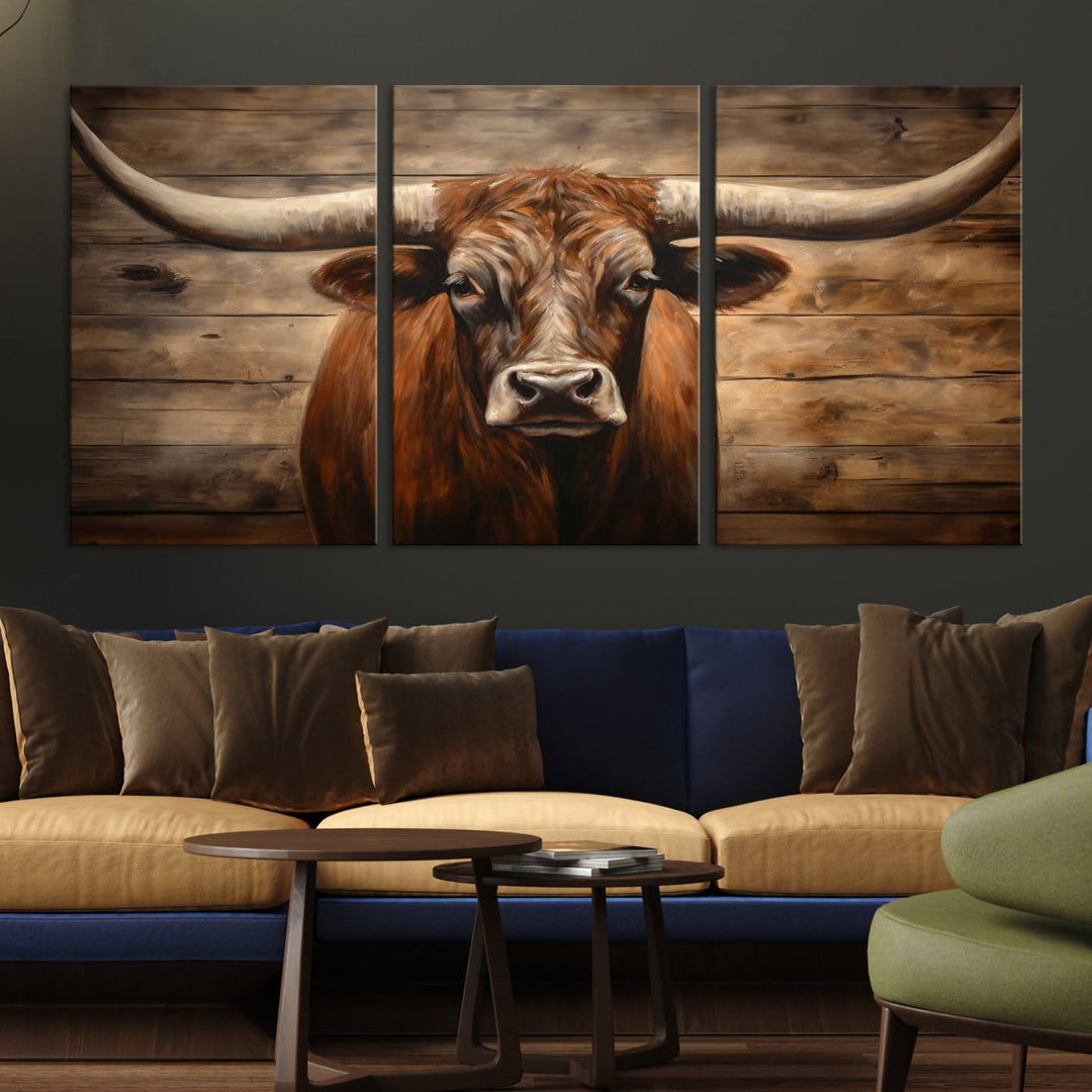 The Longhorn Bull Wall Art, a ready-to-hang canvas print, showcases an image of a brown longhorn cow set against a wooden background, perfect for those looking to enhance their space with rustic farmhouse and western barn decor.