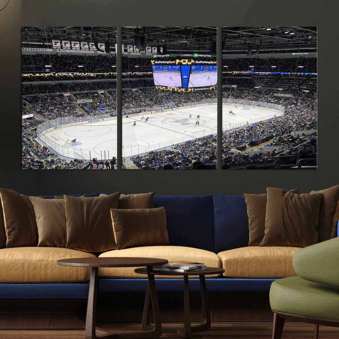 A large Enterprise Center canvas of a crowded hockey arena hangs prominently.