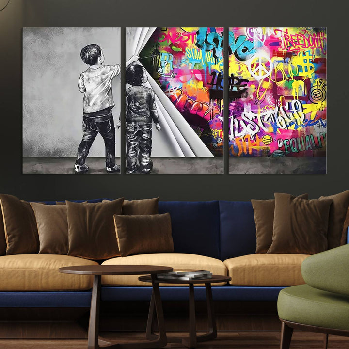 The Banksy Print - Street Art Canvas features a vibrant and bold image of two children lifting a curtain to reveal colorful graffiti. It's ready to hang, adding an urban modern decor vibe.