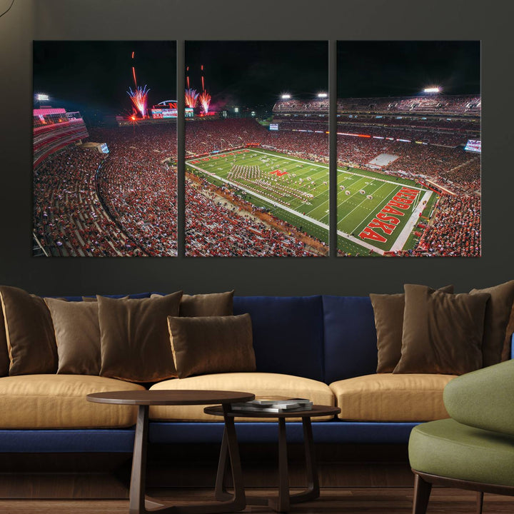 The University of Nebraska Cornhuskers Football Team Print, featuring Lincoln Memorial Stadium in a vibrant triptych canvas with fireworks above and a gallery-quality finish, is elegantly displayed.