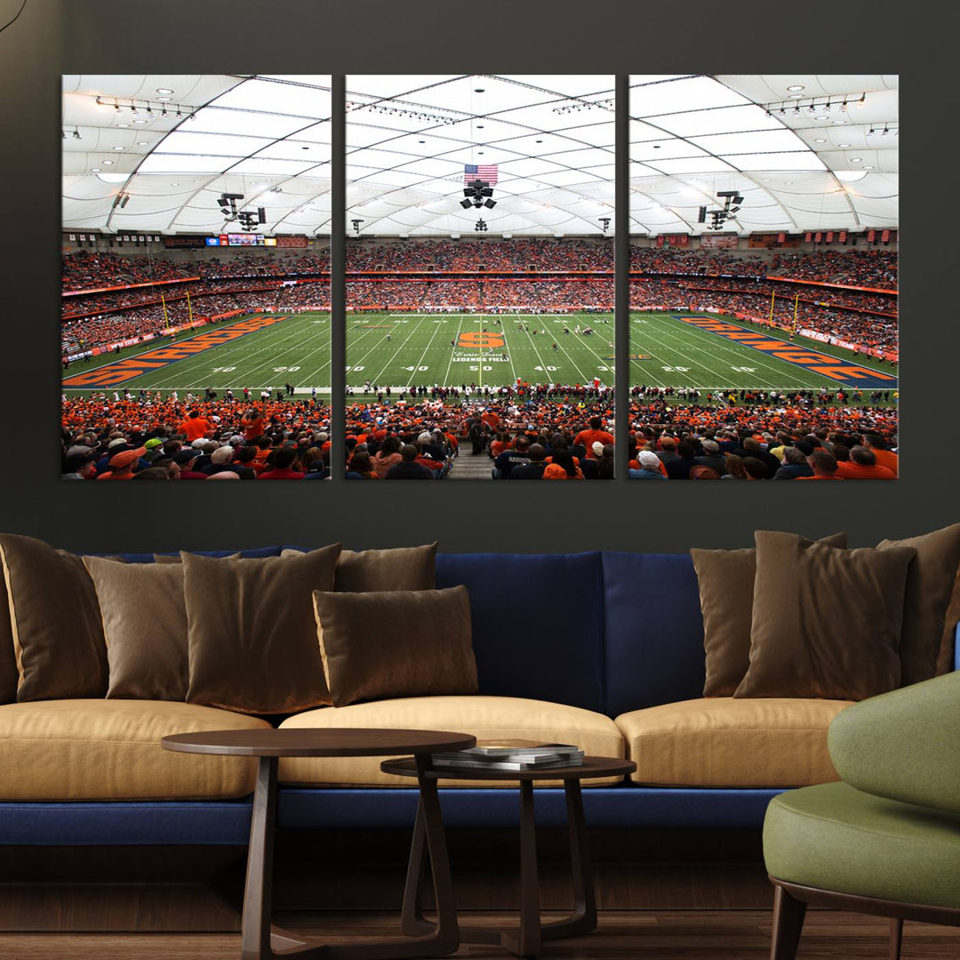 Fans fill the Syracuse JMA Wireless Dome, highlighted in orange and blue under a vaulted roof on this premium canvas print of the scene.