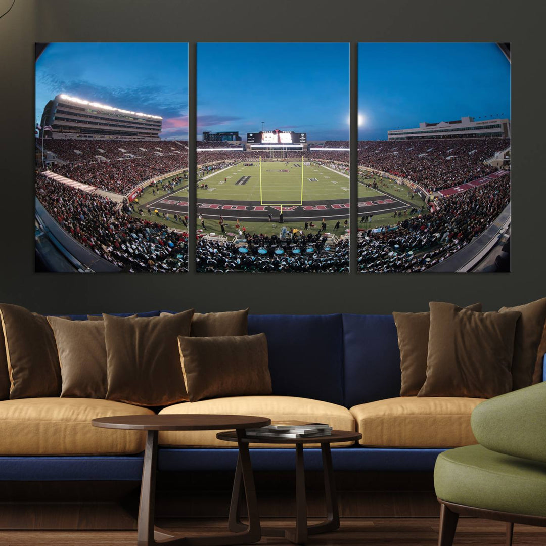 The wall art in the living room features a Texas Tech Red Raiders Football Team Print, showcasing Jones AT&T Stadium at dusk.