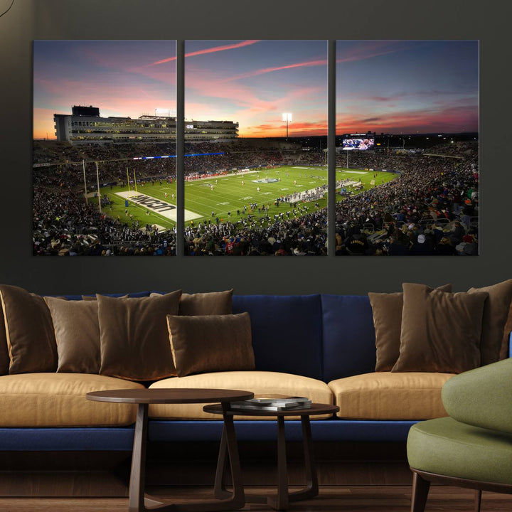 This wall art canvas print captures UCONN Huskies fans energizing a sunset scene at East Hartfords Pratt & Whitney Stadium.