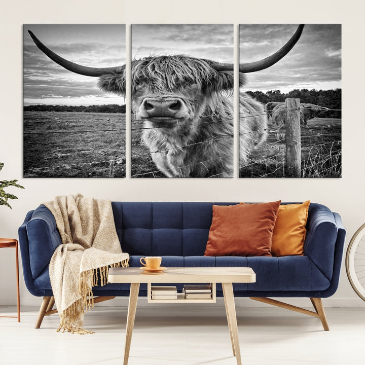 The "Scottish Highland Cow Canvas Wall Art Farmhouse Decor" adds a touch of rustic charm to your living room wall above the couch.