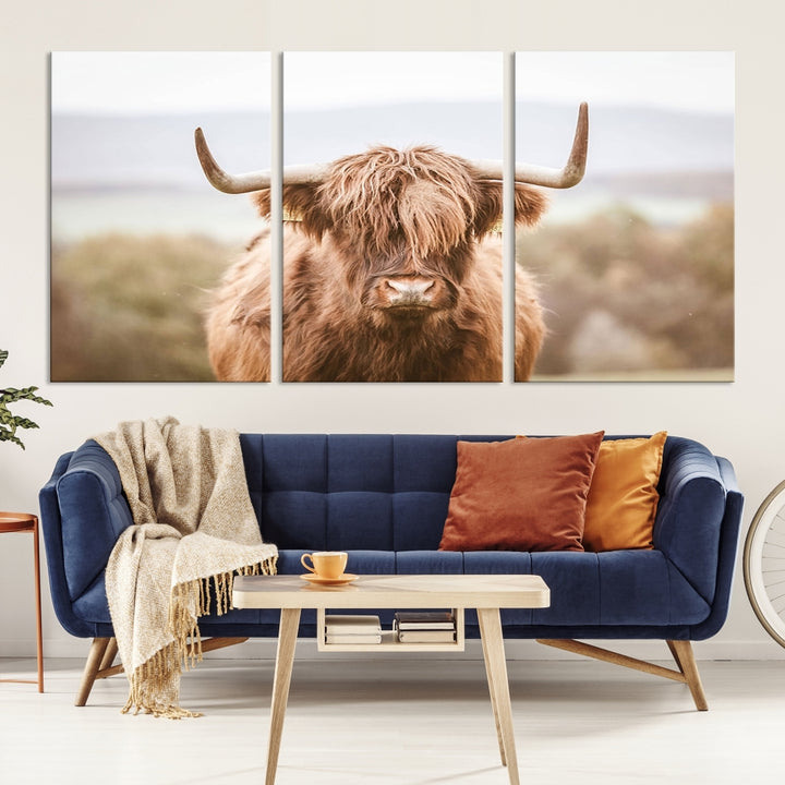 Canvas wall art featuring a Highland cow with long, shaggy fur in natural pastel tones, ready to hang.