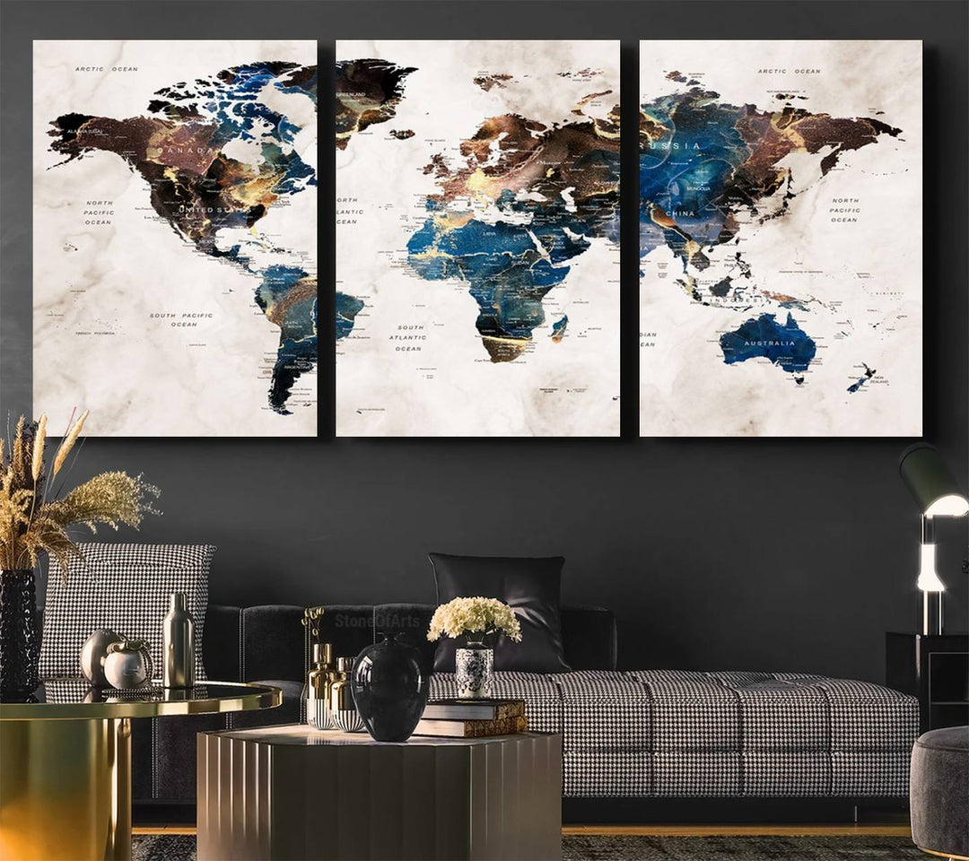 Abstract earth-toned 3-panel world map wall art featuring blues and browns, ready to hang; it showcases continents on modern canvas.