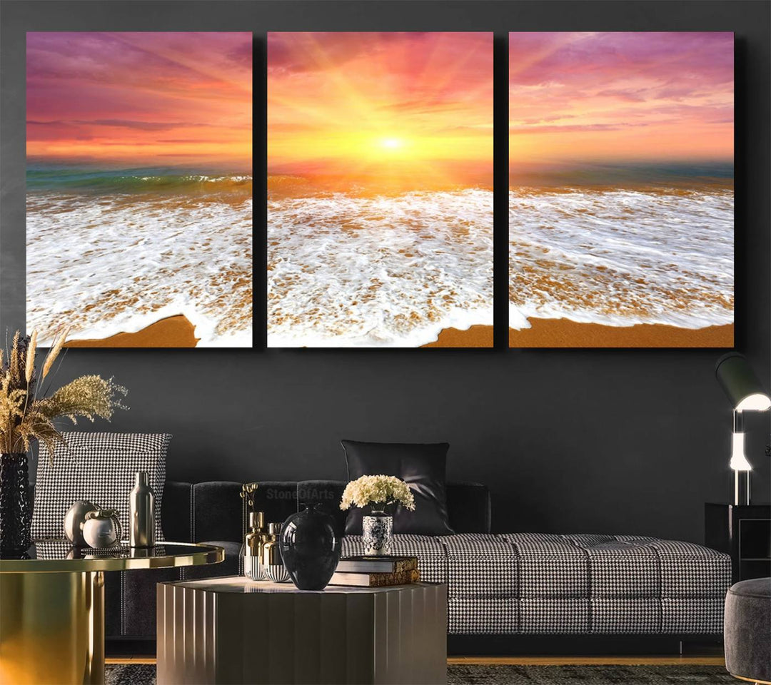 Golden Beach Sunrise 3-panel canvas art of ocean waves, hung on a wooden wall.