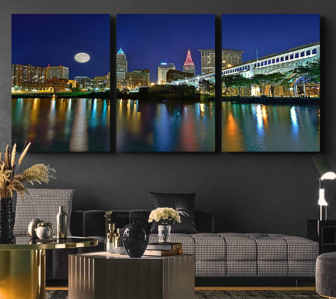 Cleveland City Lights Night Skyline Wall Art canvas showcases a moonlit cityscape reflected on water.