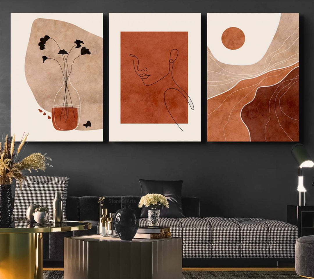 A giclée canvas triptych showcases minimalist mountain landscapes in earthy tones.