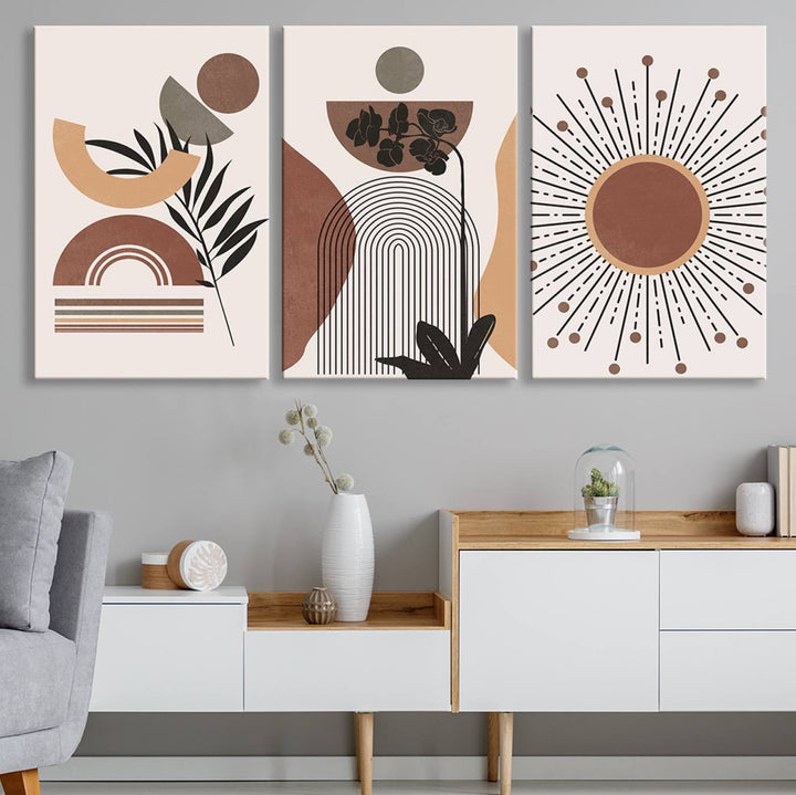 A trio of Boho Wall Art Canvas Print Sets, showcasing mid-century and bohemian styles on museum-quality canvas, adorn the wall.