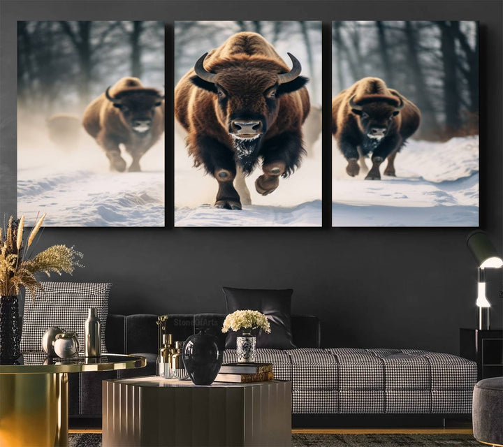 Wall art titled Cow Bighorn shows three bison running through snow in a forest.