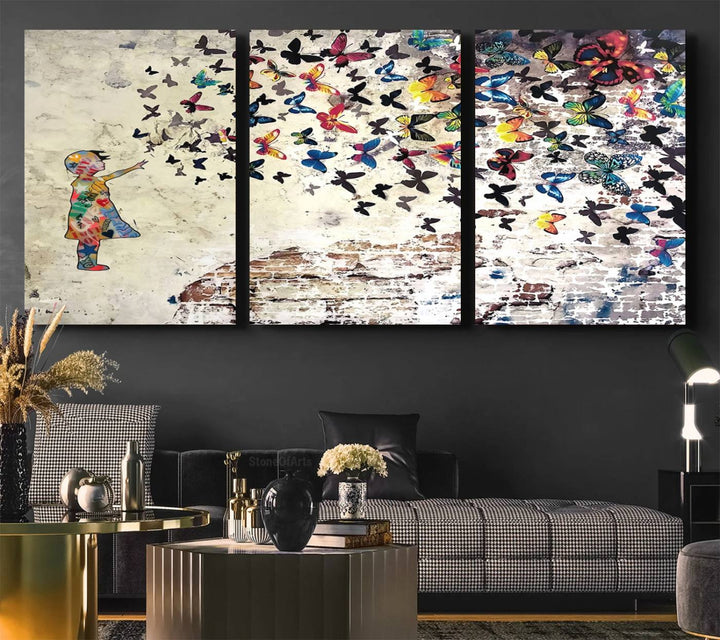 A Banksy Girl Butterfly Canvas Print is displayed on the textured wall.