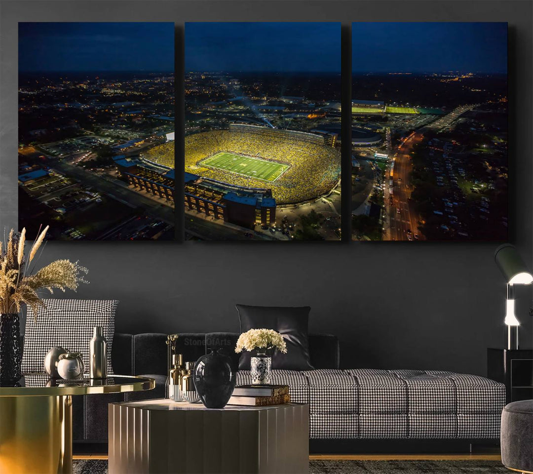 Aerial view of Michigan Stadium at night, surrounded by city lights, depicted on a Michigan Wolverines wall art canvas print.