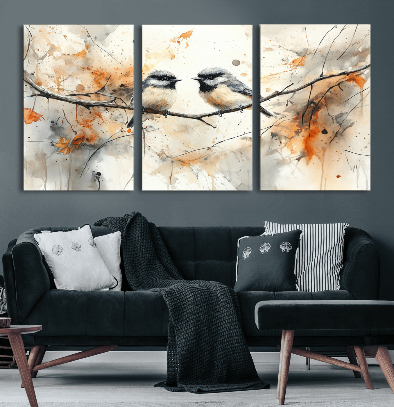 A soft and elegant watercolor painting of two chickadees perched on a delicate branch, surrounded by splashes of orange and neutral tones evoking a calm autumn day.