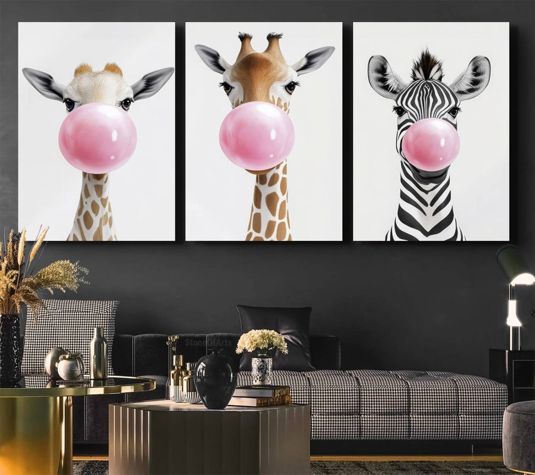 The Bubblegum Animals Canvas Wall Art, featuring a playful trio of giraffe and zebra portraits blowing pink bubblegum, brings charm and whimsy to your space. Ideal for nursery wall art or any fun area, this delightful decor piece is ready to hang and perfect for creating a playful atmosphere.