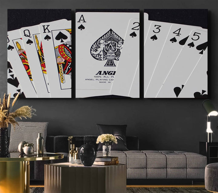 The Poker Wall Art - Playing Cards Canvas Wall Art Print features an Ace of Spades and Royal Flush design. This piece adds a classic charm to any space with its subtle emphasis on the Ace of Spades, making it perfect for game room decor.