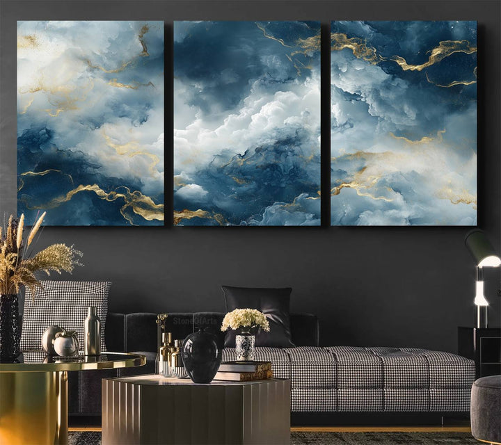 Modern living room featuring the Large Abstract Print - Luxe Blue and Gold Abstract Canvas Wall Art that showcases a bold cloudscape, perfect for modern home decor.