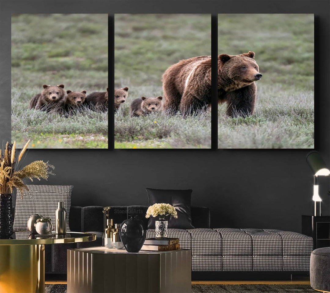 The large canvas print titled "Queen of the Tetons, 399 Grizzly Bear Cubs" showcases majestic wildlife photography of a bear and her cubs walking through the grass. This stunning canvas wall art, handmade in the USA, adds a charming touch to any room with its rustic decor appeal.