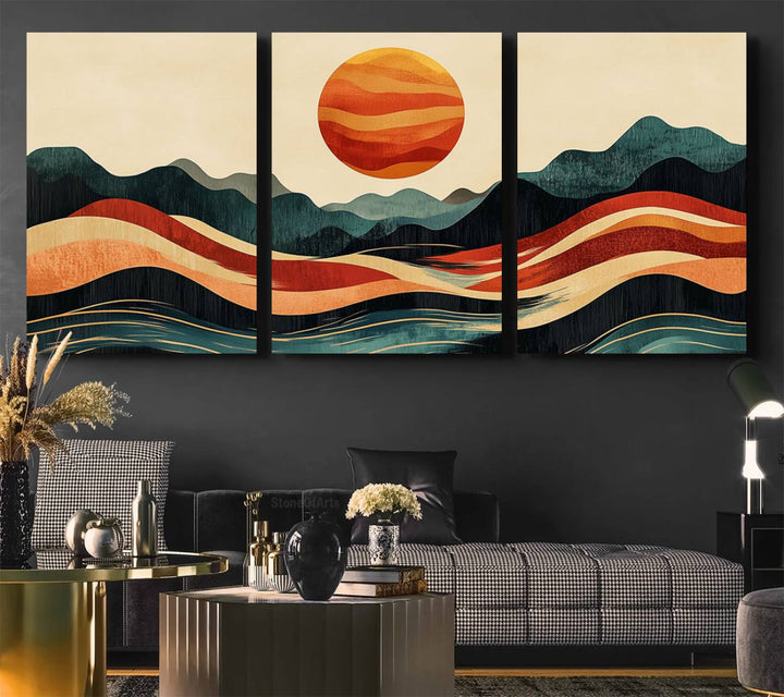 The Mountain Triptych wall art, featuring a design of the sun, mountains, and waves, is displayed prominently on the wall.